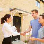 sellers checklist. a realtor shaking hands with her new clients in front of a home