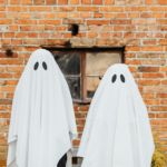 two people wearing sheets to look like ghosts